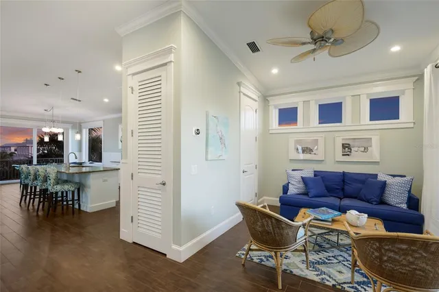 a living room with furniture a rug and a flat screen tv