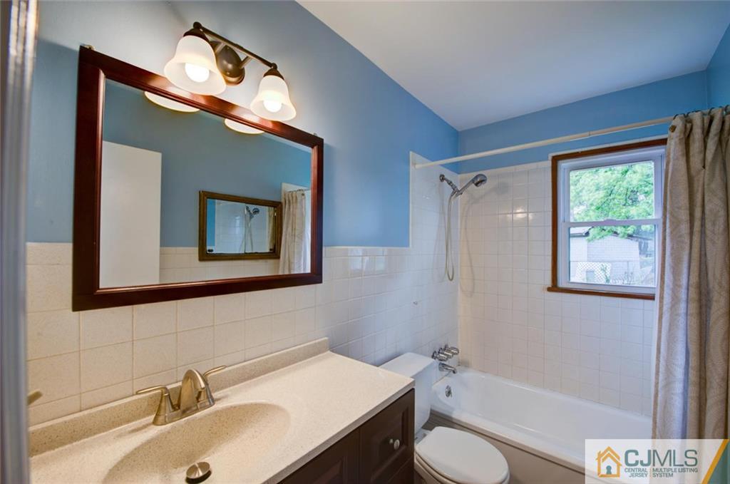 31 Raleigh Road Edison, NJ 08817 - Photo 14 of 23 a bathroom with a sink toilet and shower