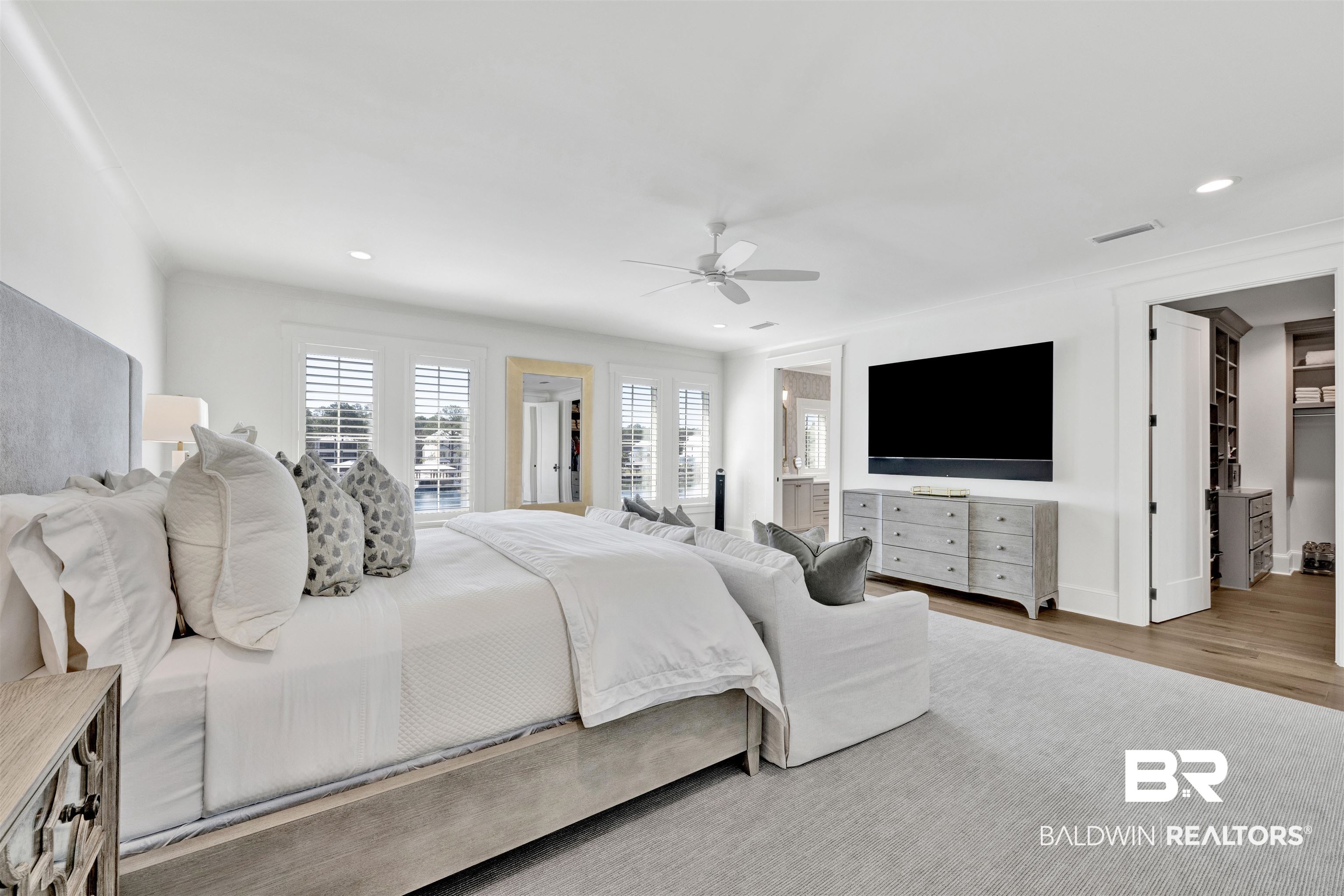 861 Inlet Circle Gulf Shores, AL 36542 - Photo 23 of 54 Bedroom featuring a ceiling fan, connected bathroom, wood finished floors, and recessed lighting