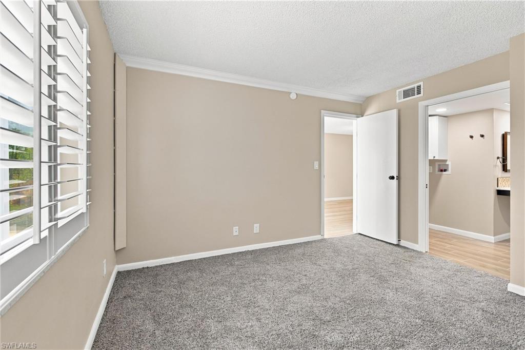 1000 Manatee Road, Unit A102 Naples, FL 34114 - Photo 9 of 28 Primary Bedroom