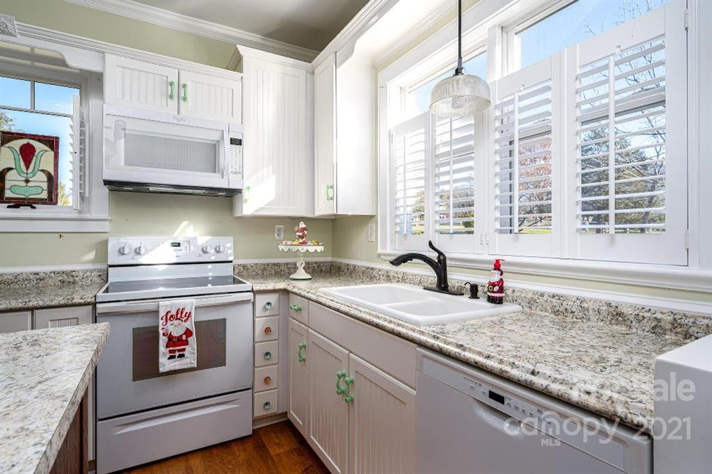 2497 Settlemyre Bridge Road Newton, NC 28658 - Photo 14 of 40 a kitchen with stainless steel appliances granite countertop a sink and a stove