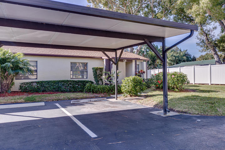 6028 Indrio Road, Unit M4 Fort Pierce, FL 34951 - Photo 2 of 10 6028 Indrio M4 Carport
