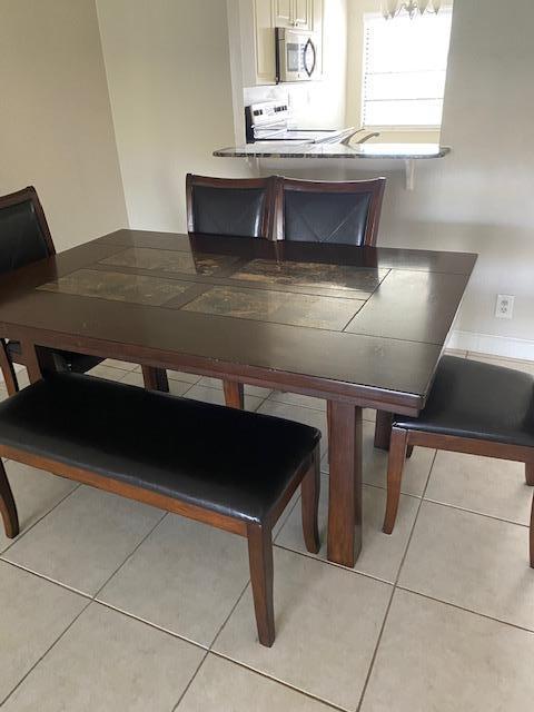 6028 Indrio Road, Unit M4 Fort Pierce, FL 34951 - Photo 8 of 10 6028 Dining table