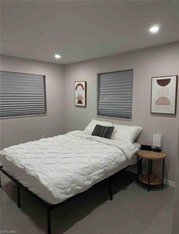 1635 Lowell Court Fort Myers, FL 33907 - Photo 4 of 15 a bedroom with a bed and a window