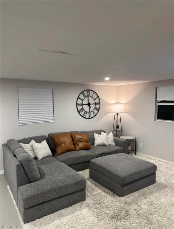 1635 Lowell Court Fort Myers, FL 33907 - Photo 5 of 15 a living room with furniture a clock and a window