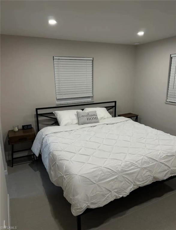 1635 Lowell Court Fort Myers, FL 33907 - Photo 8 of 15 a bedroom with a bed and window
