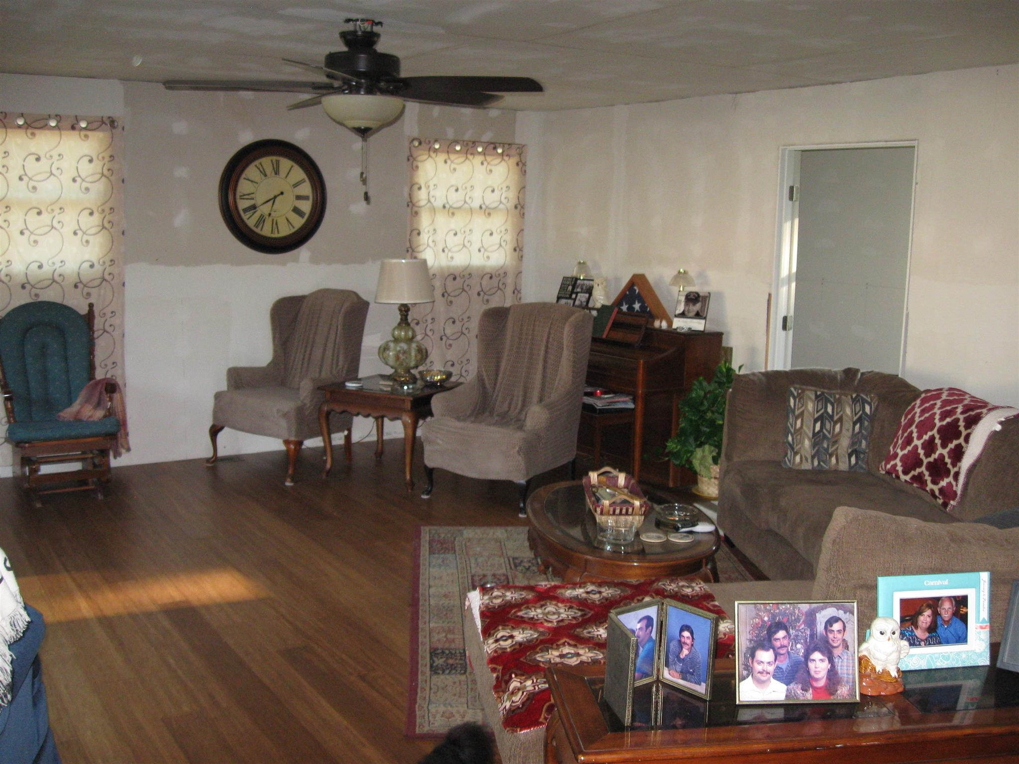 213 Black Road Dickson, TN 37055 - Photo 5 of 27 a living room with furniture a clock and a fireplace