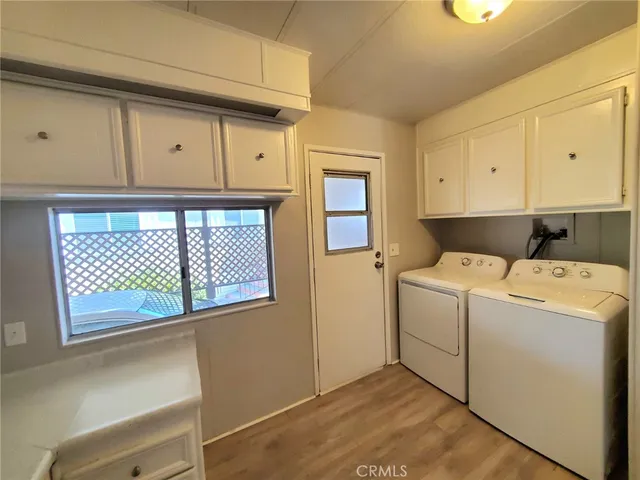 a bedroom with a bed and lamp with window