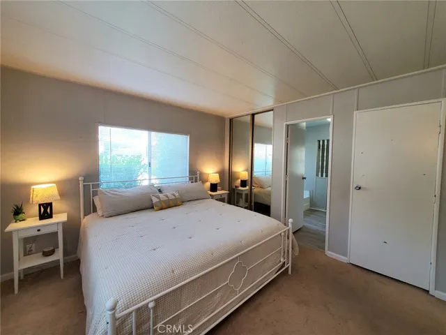 a bed room with a bed and a window