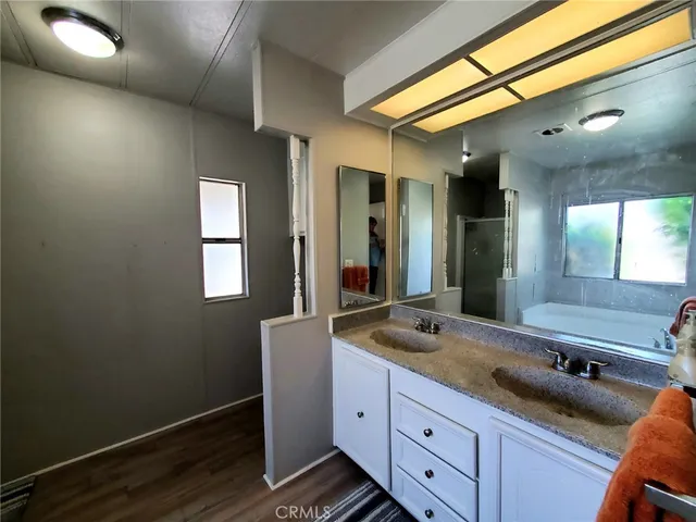 a bathroom with a tub and a window