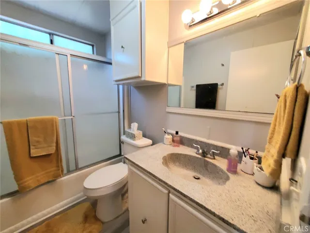 a bedroom with a bed and a table