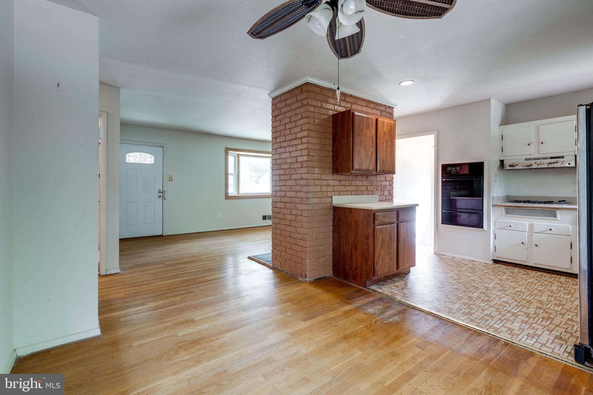 7410 Long Pine Drive Springfield, VA 22151 - Photo 20 of 53 Wood floors in dining area open to kitchen