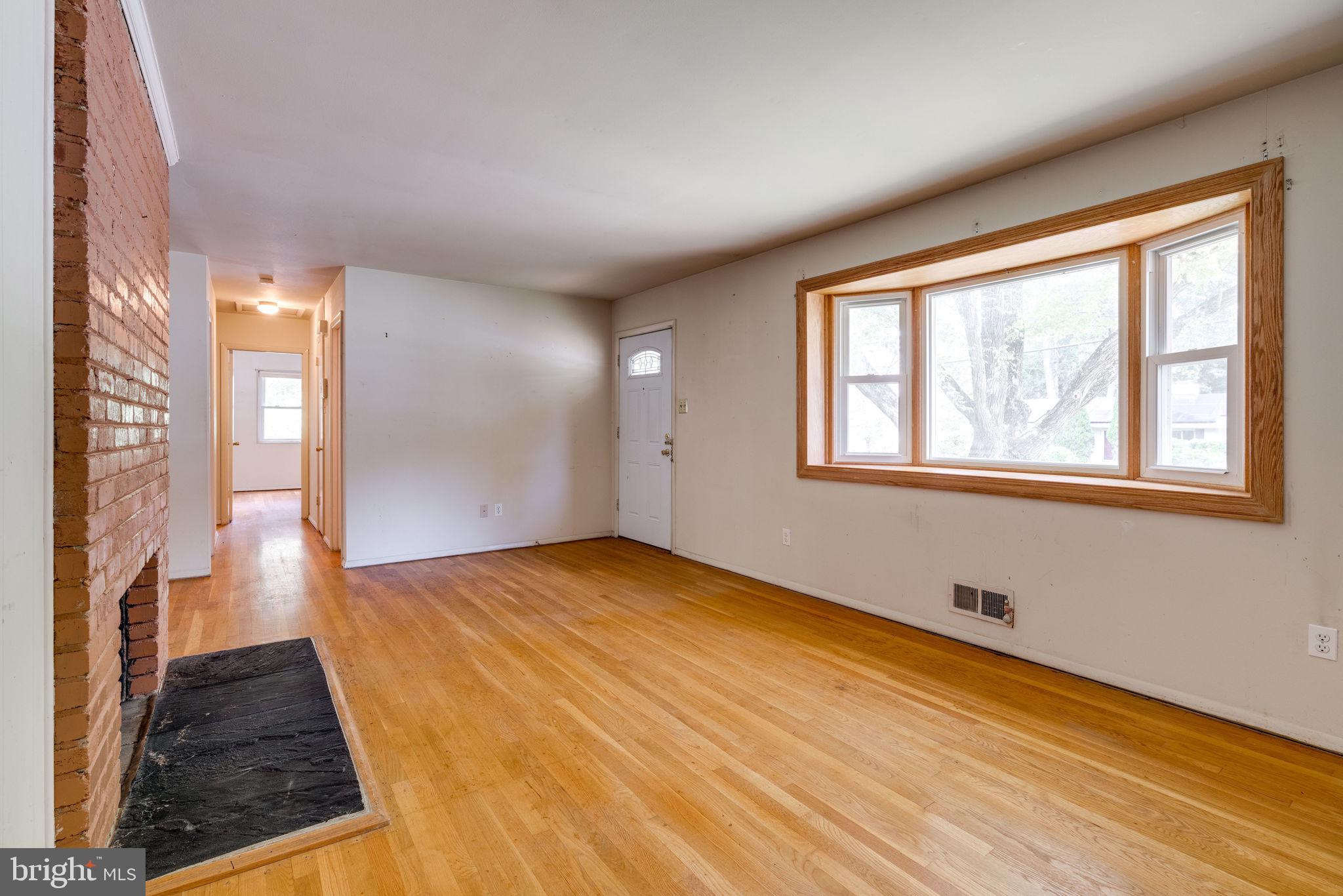 7410 Long Pine Drive Springfield, VA 22151 - Photo 9 of 53 Living room with wood floors, picture window