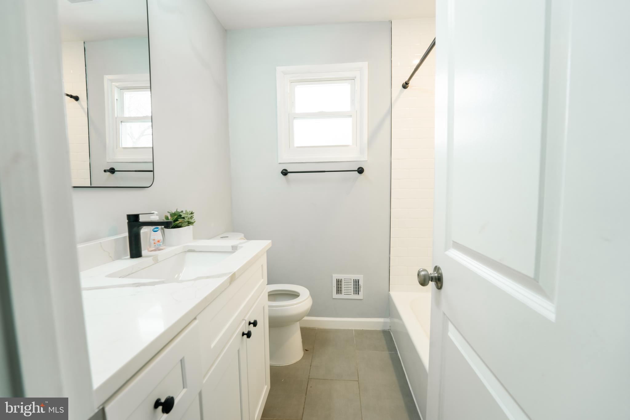 3410 Embry Street Silver Spring, MD 20902 - Photo 12 of 28 a bathroom with a sink a toilet and shower