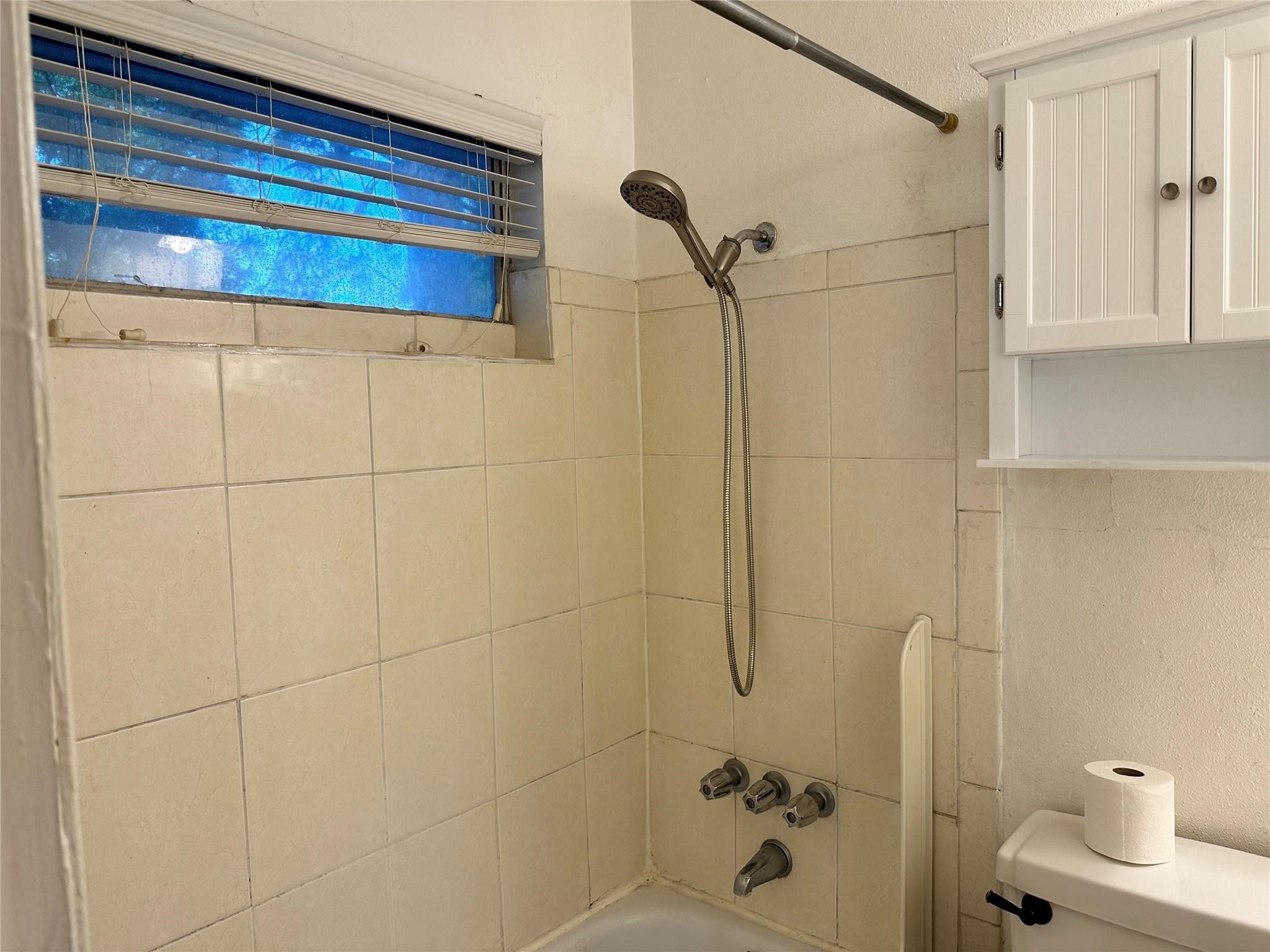 2022 Branard Street, Unit 5 Houston, TX 77098 - Photo 11 of 16 a bathroom with a shower