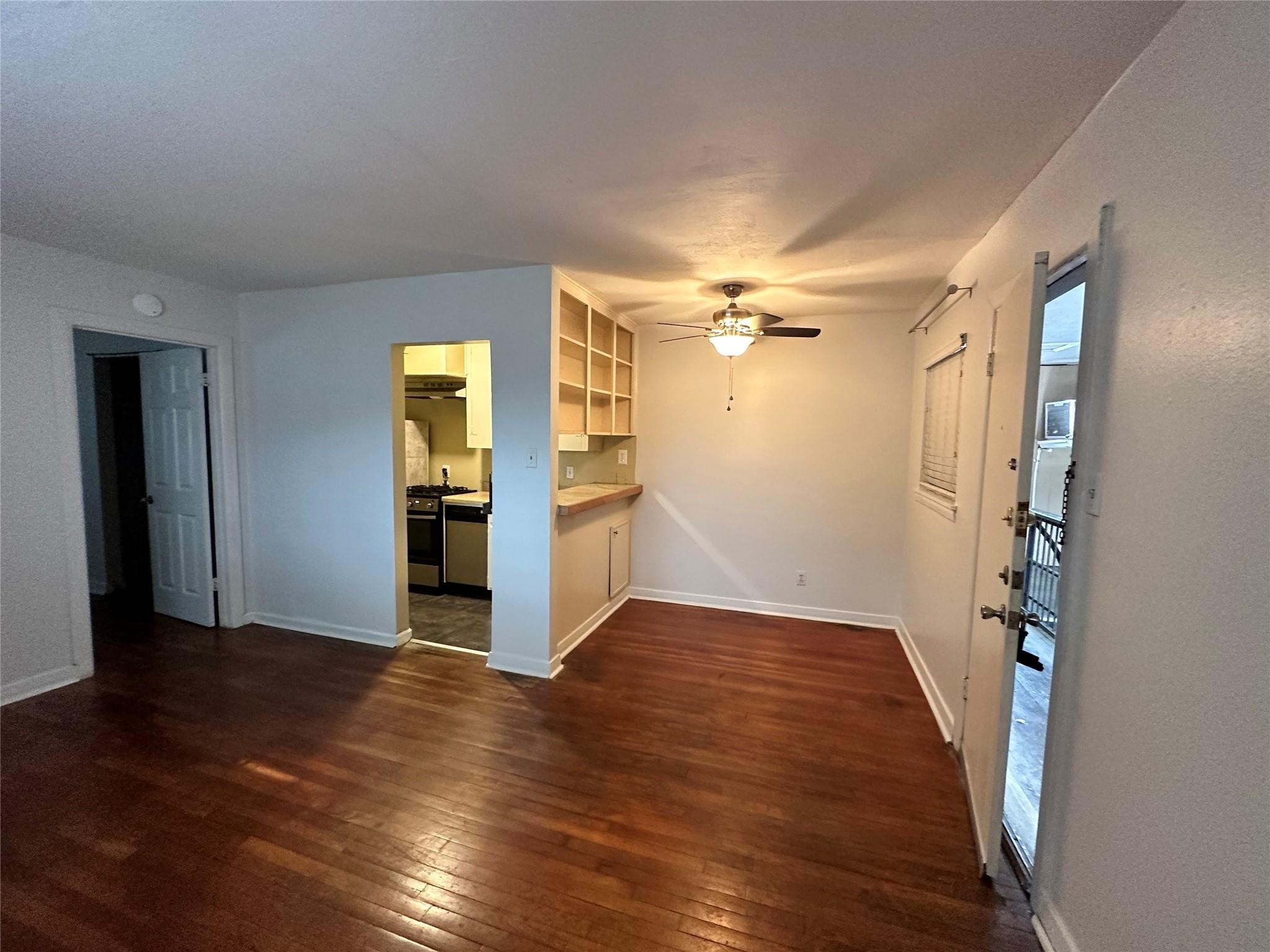 2022 Branard Street, Unit 5 Houston, TX 77098 - Photo 8 of 16 an empty room with wooden floor and entrance