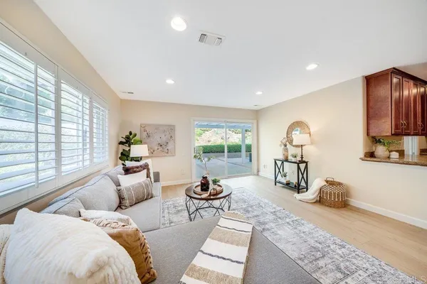 a living room with furniture fireplace and window