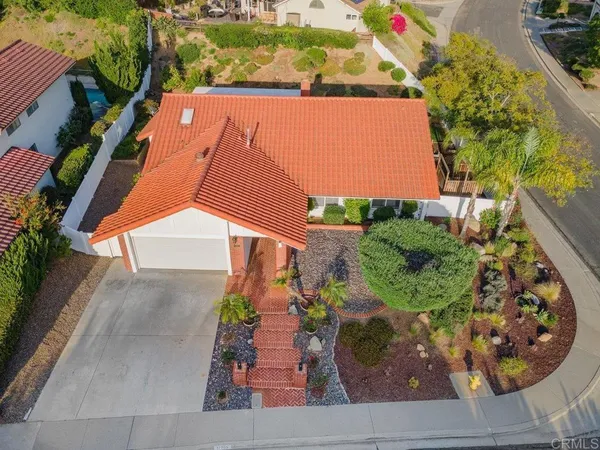 an aerial view of a house having yard