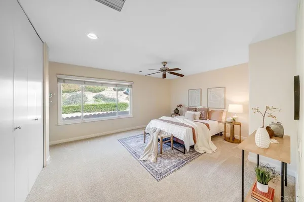 a bed room with a bed and a window