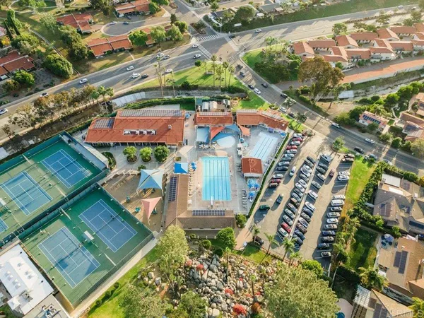 an aerial view of residential houses with outdoor space