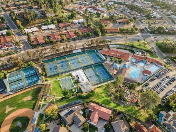 an aerial view of residential houses with outdoor space