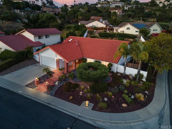 an aerial view of residential houses and outdoor space