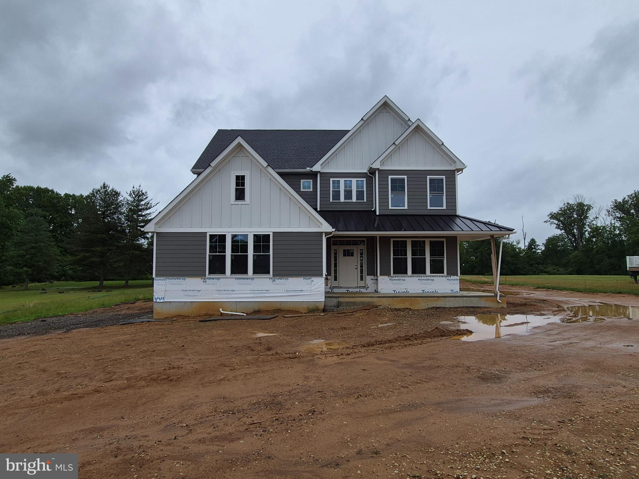 324 Bishop Hollow Road Newtown Square, PA 19073 - Photo 1 of 37 a front view of a house with a yard