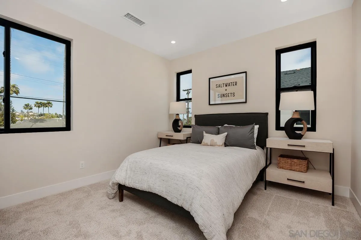 1645 Hunsaker Street Oceanside, CA 92054 - Photo 12 of 22 a bedroom with a bed and a painting on the wall