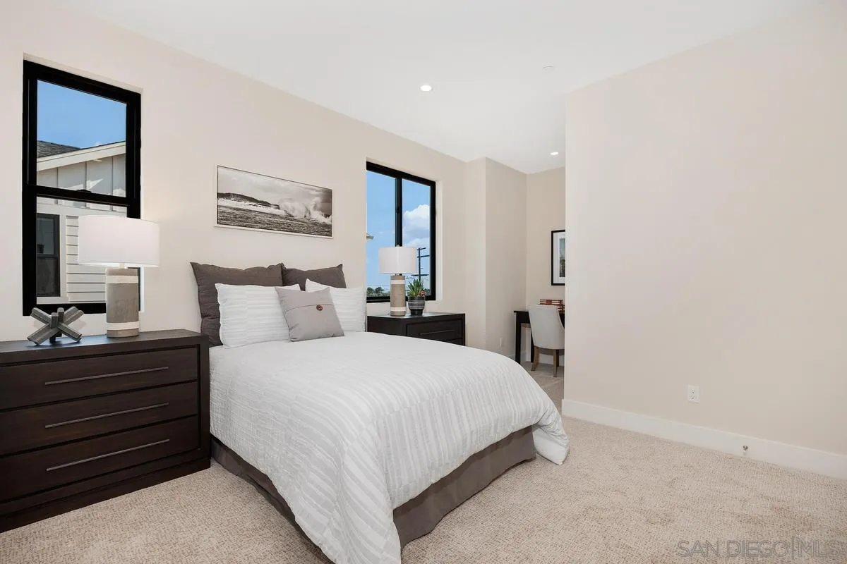 1645 Hunsaker Street Oceanside, CA 92054 - Photo 13 of 22 a bedroom with a bed and a night stand
