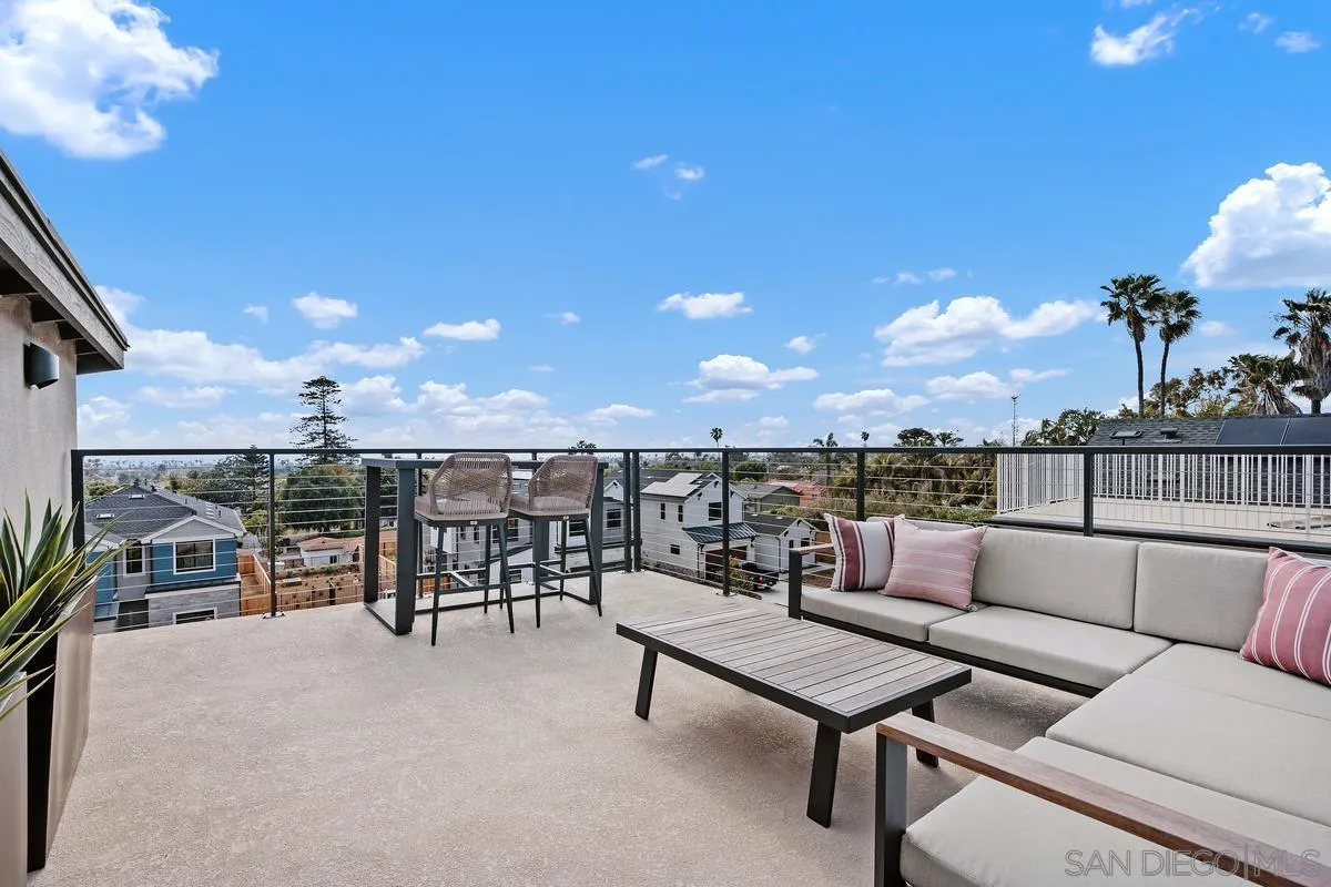 1645 Hunsaker Street Oceanside, CA 92054 - Photo 19 of 22 a roof deck with a table and chairs