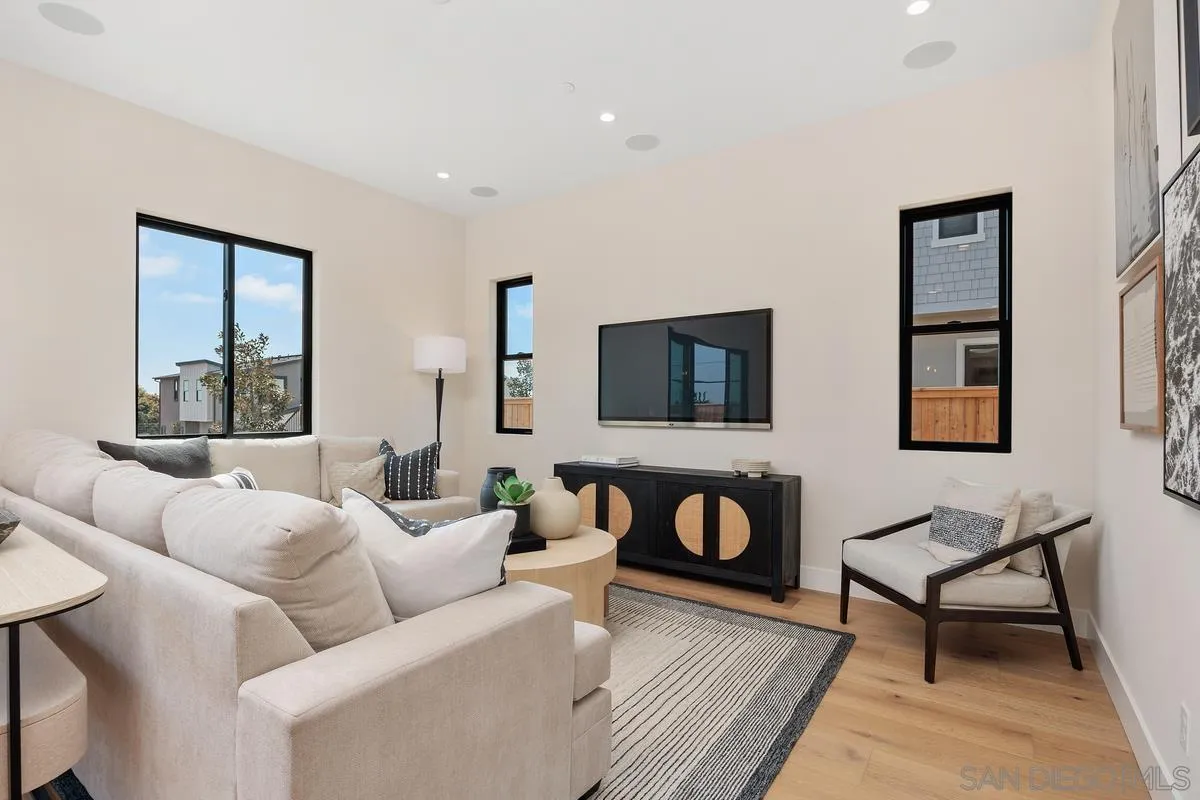 1645 Hunsaker Street Oceanside, CA 92054 - Photo 6 of 22 a living room with furniture and a flat screen tv