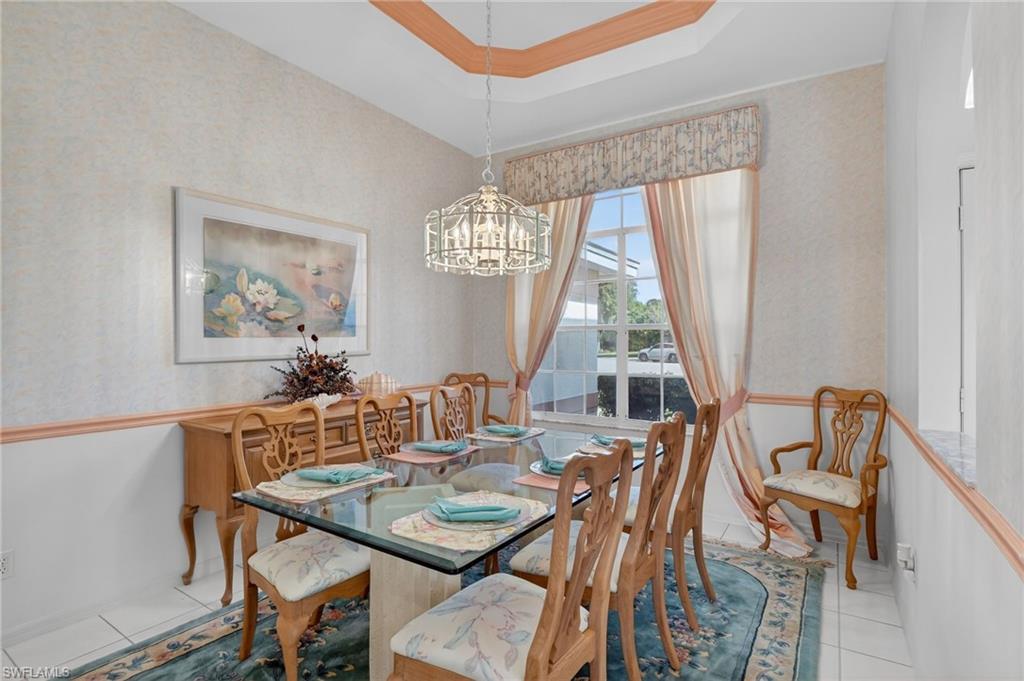 6687 Huntley Lane South Naples, FL 34104 - Photo 13 of 37 a view of a dining room with furniture window and outside view