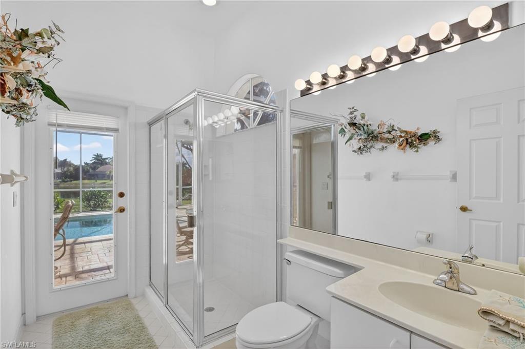 6687 Huntley Lane South Naples, FL 34104 - Photo 22 of 37 a bathroom with a sink a toilet and shower