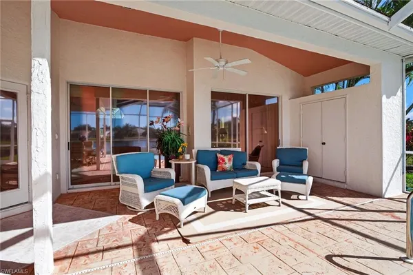 a outdoor space with patio furniture and glass door