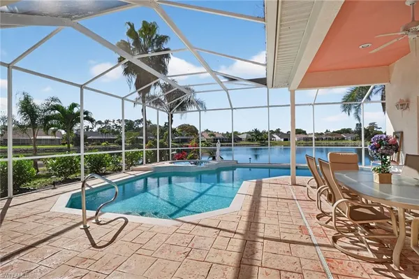 a view of a swimming pool with a patio