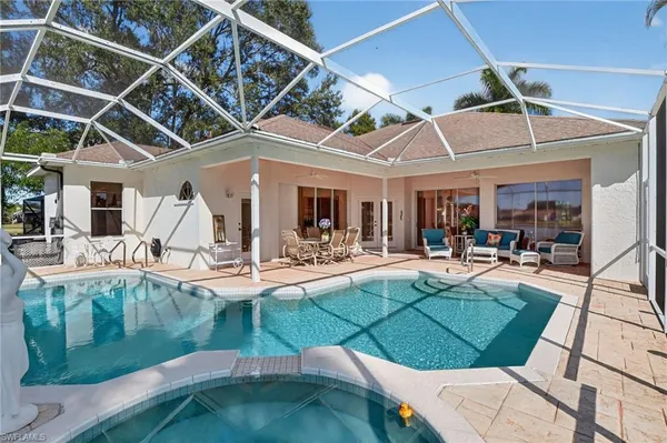 a view of a backyard with swimming pool