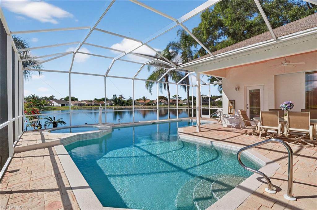 6687 Huntley Lane South Naples, FL 34104 - Photo 30 of 37 a view of a patio with chairs and tables