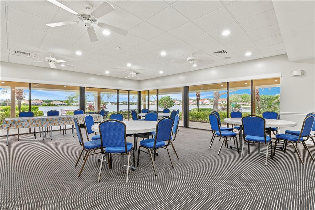 6687 Huntley Lane South Naples, FL 34104 - Photo 36 of 37 a view of a dining room with furniture window and outside view