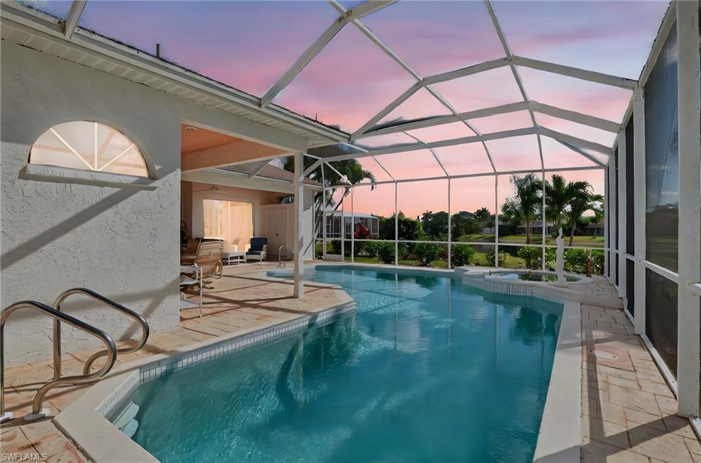 6687 Huntley Lane South Naples, FL 34104 - Photo 4 of 37 a view of a house with a backyard