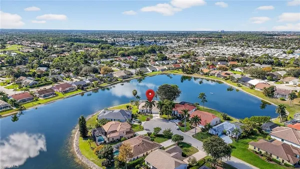 an aerial view of a house with a swimming pool
