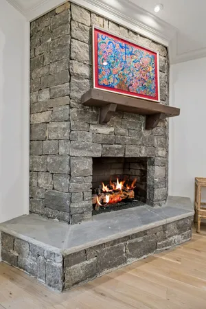 a view of a dining room with furniture wooden floor and a chandelier