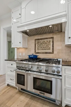 a large kitchen with granite countertop lots of counter top space