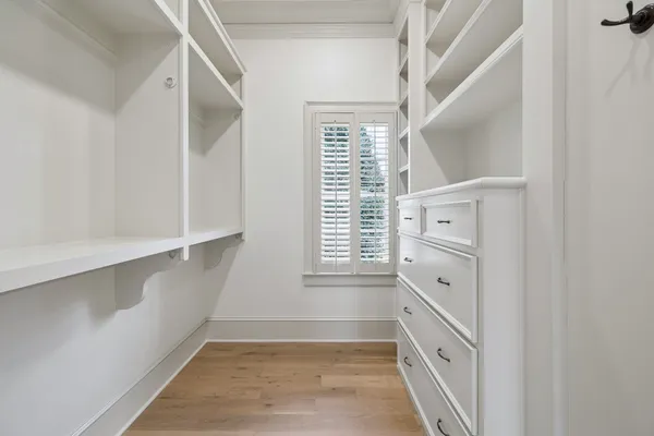 a bathroom with a granite countertop toilet a sink and a bathtub