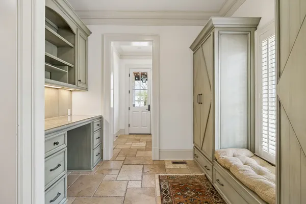 a bedroom with a large bed and a large window