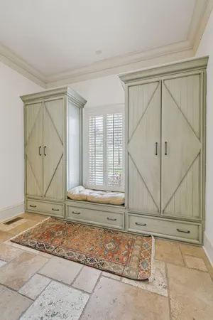 a bathroom with a double vanity sink toilet and shower