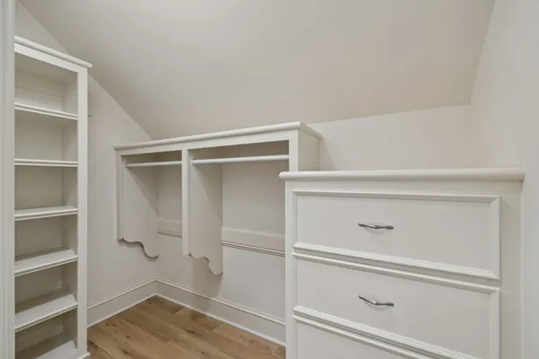 an aerial view of a house with a yard and lake view