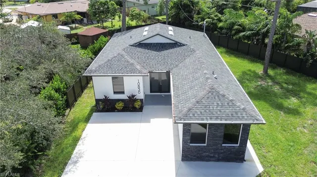 an aerial view of house with yard