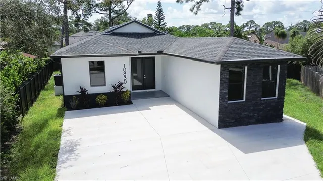 an aerial view of a house with a garden