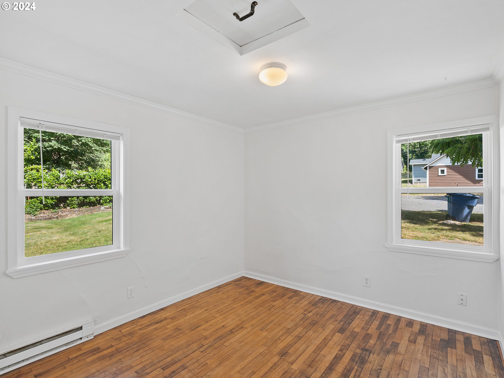 2311 Southwest 6th Avenue, Unit 6 Camas, WA 98607 - Photo 22 of 32 a view of room with window and wooden floor