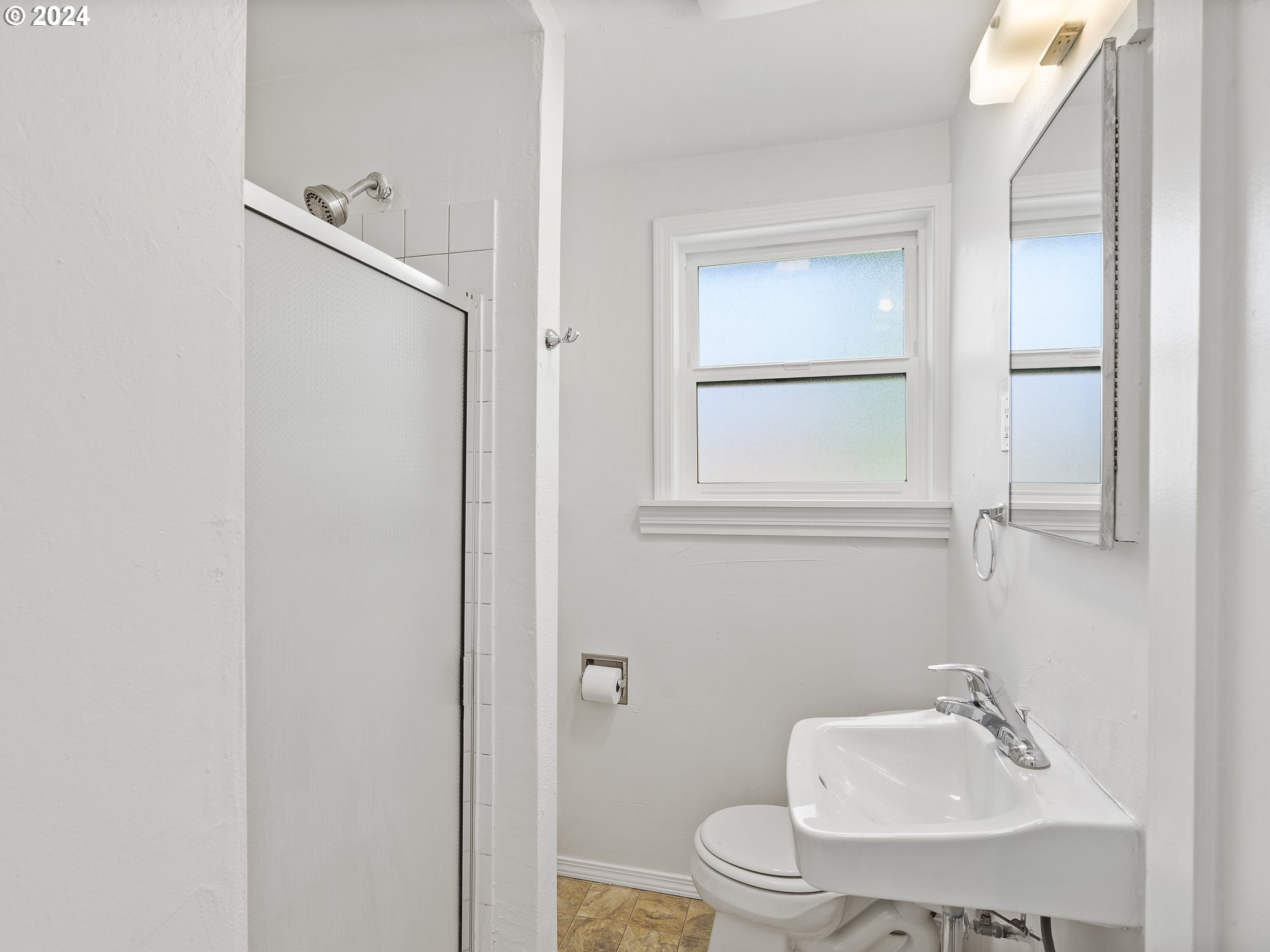 2311 Southwest 6th Avenue, Unit 6 Camas, WA 98607 - Photo 23 of 32 a bathroom with a sink a toilet and shower